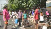 Delhi: Chilla village residents stand in long queues to get drinking water amid lockdown 