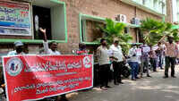 Visakhapatnam: APEPDCL meter readers protest over salary delay, demand masks for safety 