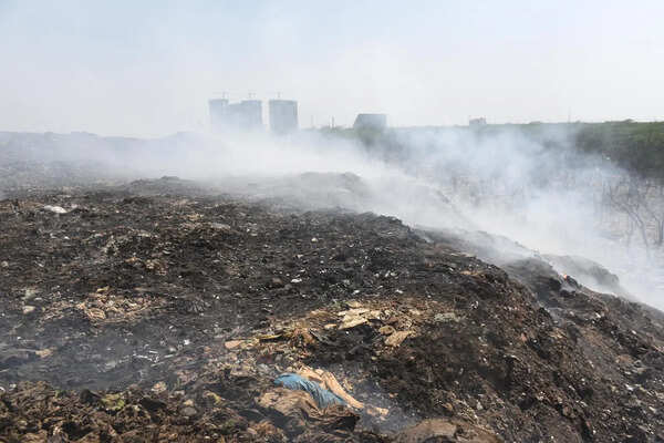 4-day fire at dumping site uncovers massive garbage backlog