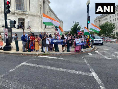 Members of the Indian diaspora stand outside Capitol Hill, as they await the arrival of Prime Minister Narendra Modi.