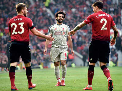 Liverpool returns to top against injury-hit Manchester United