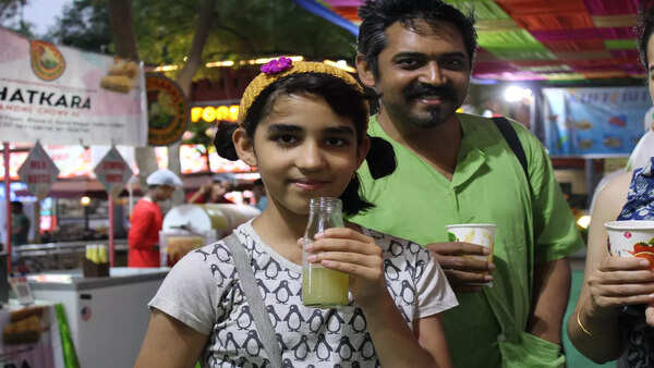 A young visitor enjoys a cool drink