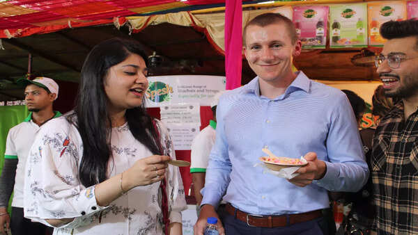 Visitors Astha and Ben enjoyed some fruity delights at the Sharbat Mela
