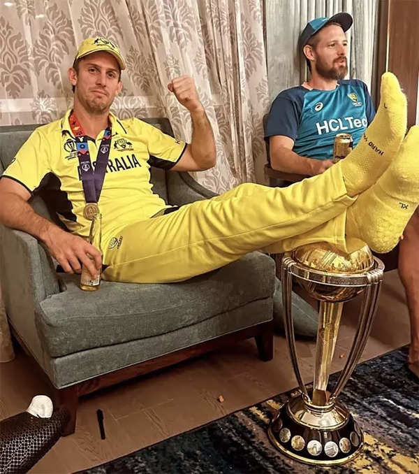 Mitchell Marsh draws flak over 'feet on trophy' viral photo after World Cup  final win | Cricket News - Times of India