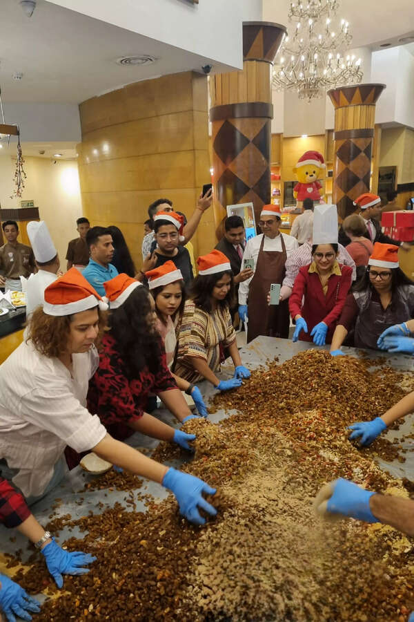 Iconic bakery hosts a cake mixing session - Times of India