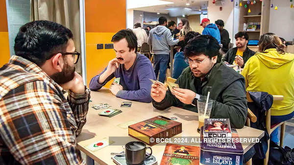 Board gamers play a game of Coup