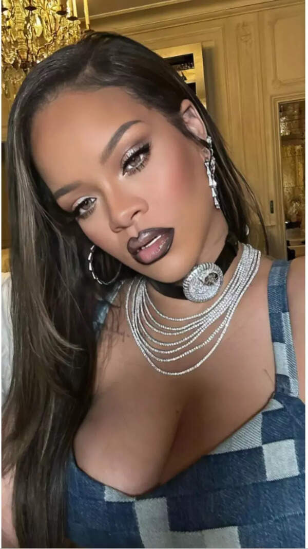 Rihanna dons a funky choker with watch on it