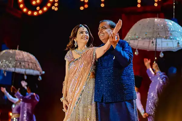 Jamnagar: Reliance Industries Chairman Mukesh Ambani with wife Nita Ambani perfo...