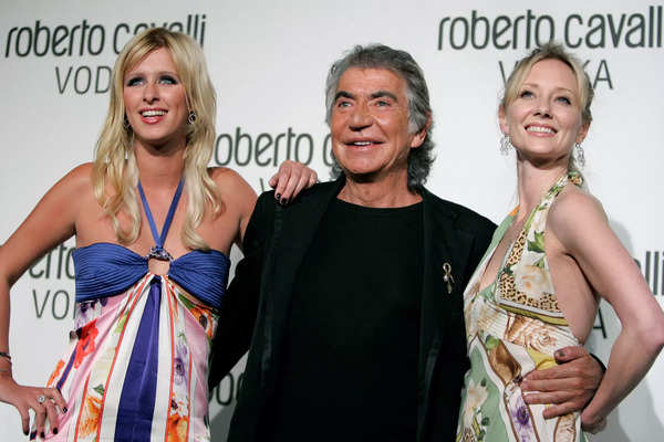 FILE PHOTO: Roberto Cavalli poses with Nicky Hilton and Anne Heche at the launch party for Roberto Cavalli Vodka in Los Angeles