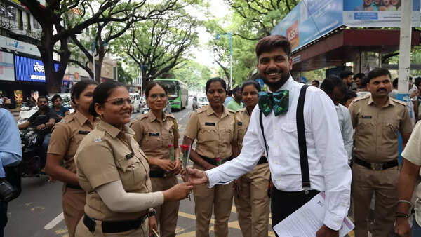 Pride march welcomes security offcials with roses