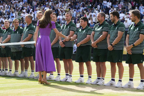 Kate, the Princess of Wales, hands Carlos Alcaraz his Wimbledon trophy in a rare appearance for her