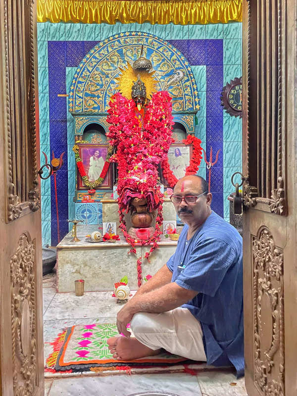 Shekhar Lal Goswami offers prayers at Sri Sri Siddheswari Kali Mandir in Dhaka on Friday.