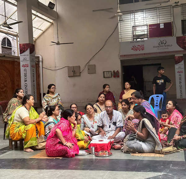 People perform 'kirtan' inside the 583-year-old temple in Dhaka on Friday.