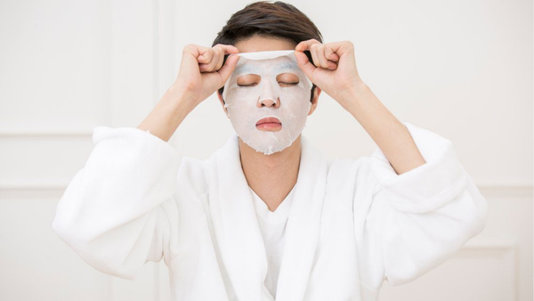 Man using a Korean skincare mask