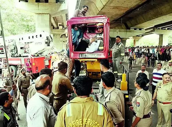 Woman falls over overpass and lands on the pillar surface below