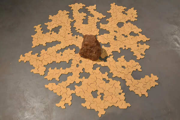 An installation named Nature of Landscape (Ceramic tiles and rock from Hampi)