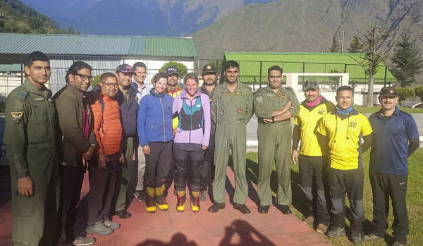 Rescued mountaineers with the evacuation team (PTI image)