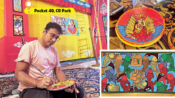 Ashish, a school teacher and artist, was seen giving final touches to a shora – handpainted earthen discs, at Pocket 40 pandal