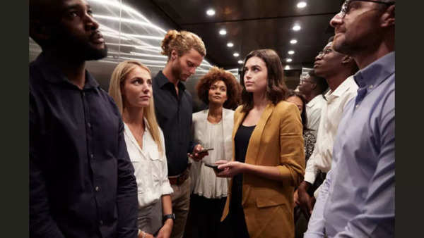 People standing in elevator - google