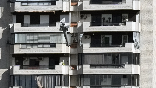 A missile launched from an Israeli jet hits a building in Ghobeiri, Beirut (AP)