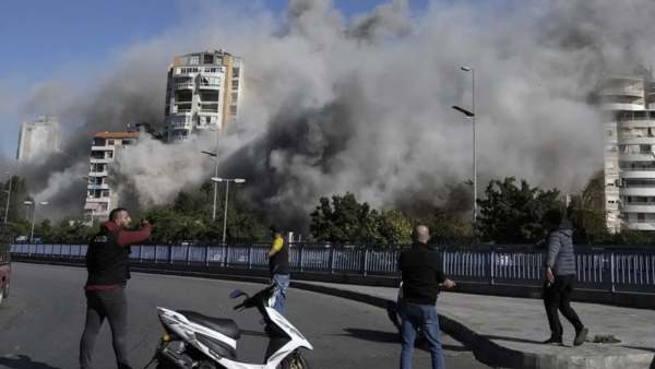 Smoke rises from a building that was hit by an Israeli airstrike in Ghobeiri (AP)