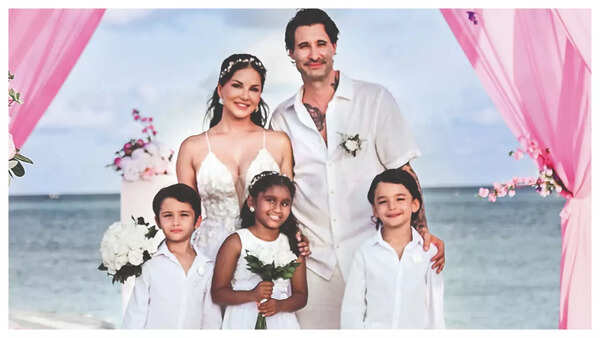 Sunny and Daniel, along with their children—Nisha, Noah, and Asher—at the ceremony
