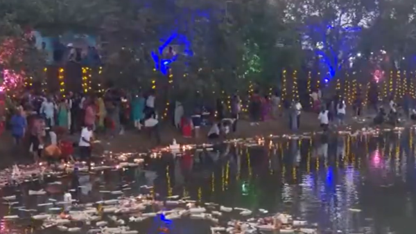 People set afloat miniature boats to mark Boita Bandana (boat festival).