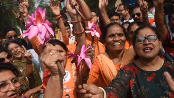 Women BJP workers celebrate in Nagpur, holding lotus symbols, after the party's landslide victory in the Maharashtra Assembly election results.