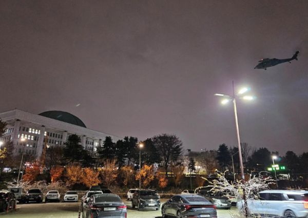 Helicopter flies around the National Assembly hall