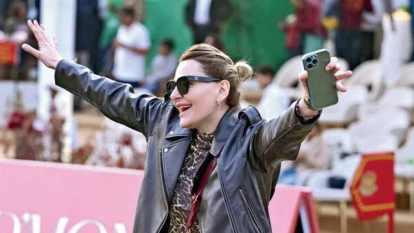 An attendee cheers on the players