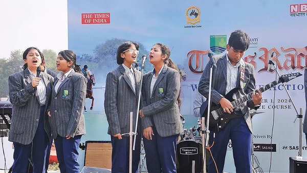 Students of a city school performing at the races