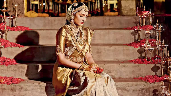 Opt for a metallic or embellished waistbelt that complements the bridal outfit, like a gold or silver kamarbandh paired with a lehenga or sari