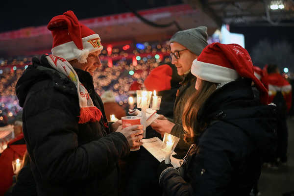 German soccer club 1. FC Union Berlin fans sing traditional Christmas carols, in Berlin