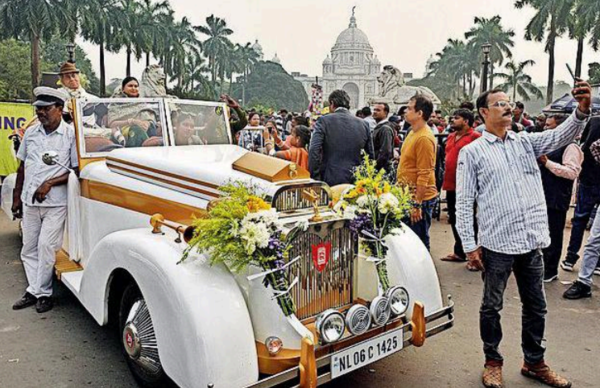 VIsitors in front of the faux vintage car busy taking selifies