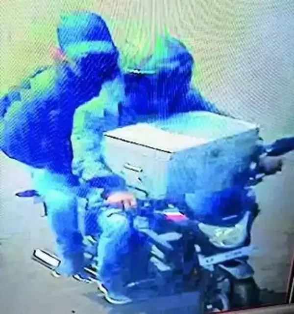 The armed robbers kept the steel cash box on the bike’s petrol tank & fled