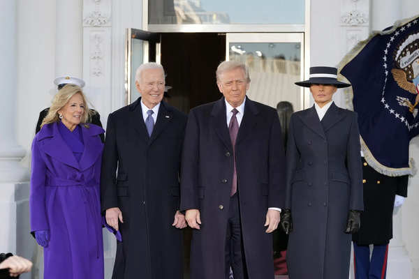 President-elect Donald Trump and Melania Trump are greeted by President Joe Bide...