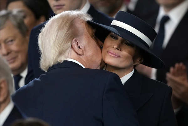 President Donald Trump kisses first lady Melania Trump during the 60th President...