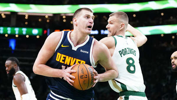 Nikola Jokic of Nuggets and Porzingis of Celtics