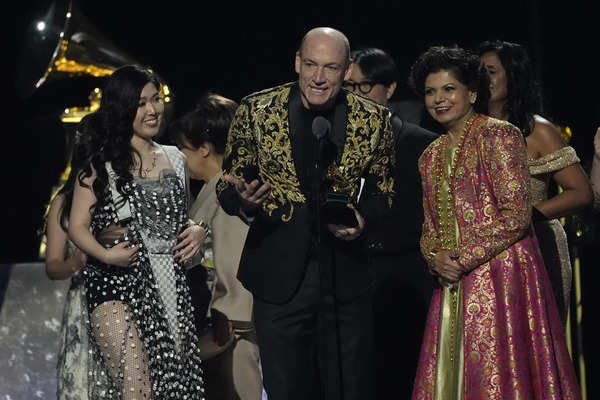 Eru Matsumoto, from left, Wouter Kellerman, and Chandrika Tandon accept the awar...