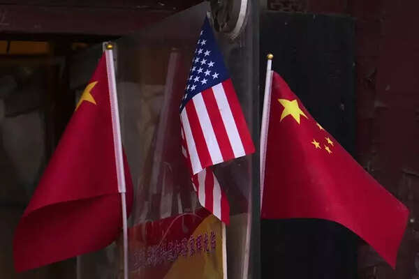 China and U.S. national flags are seen on display outside a souvenir shop in Beijing on Jan 31, 2025. (AP Photo)