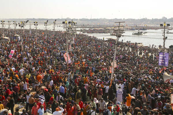 Prayagraj: Devotees arrive to take a holy dip during the ongoing Mahakumbh Mela,...