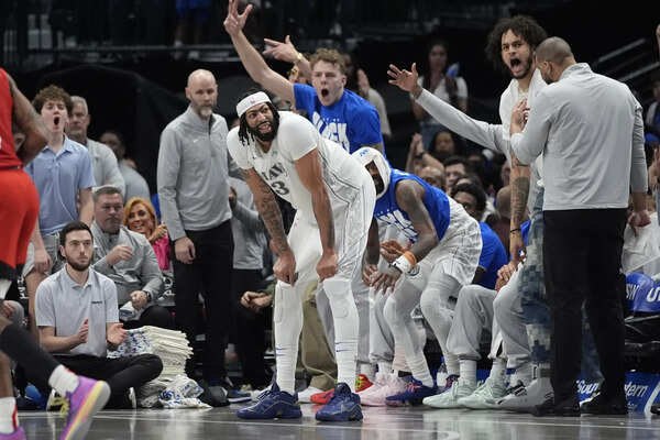 Anthony Davis leaves his Dallas debut with an injury after seismic Luka Doncic trade