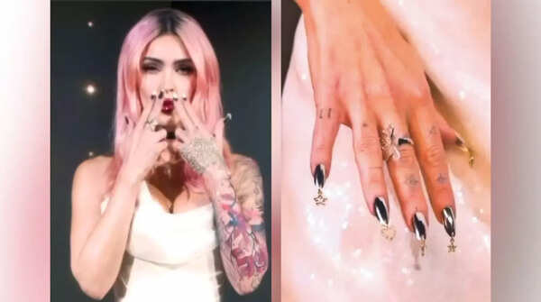 Megan Fox tried out nail piercings opting for star, cross and heart charms/@nails_of_la Megan Fox Nail Piercings