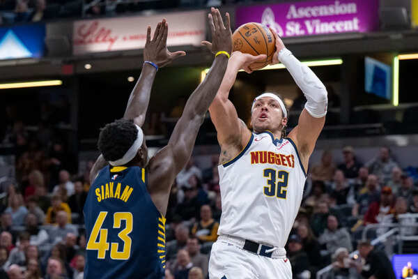 Denver Nuggets vs Indiana Pacers. Image via: Doug McSchooler/ AP Denver Nuggets vs Indiana Pacers.