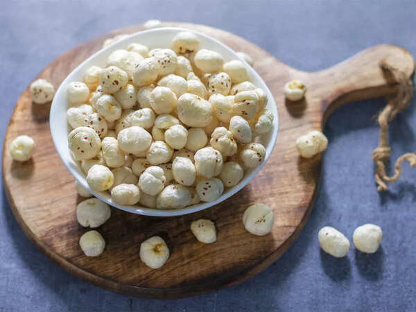 <p>Makhana, also known as fox nuts or lotus seeds, comes from the Euryale Fox plant. It is a popular snack in India, often roasted and seasoned. It is rich in protein, fiber, and antioxidants, making it a great healthy alternative to processed snacks. Makhana aids weight loss with its high protein and fiber, supports heart health by being low in cholesterol, boosts immunity with antioxidants, strengthens bones with calcium, regulates blood sugar, improves digestion, and slows aging by reducing free radicals.<br></p> What is Makhana?