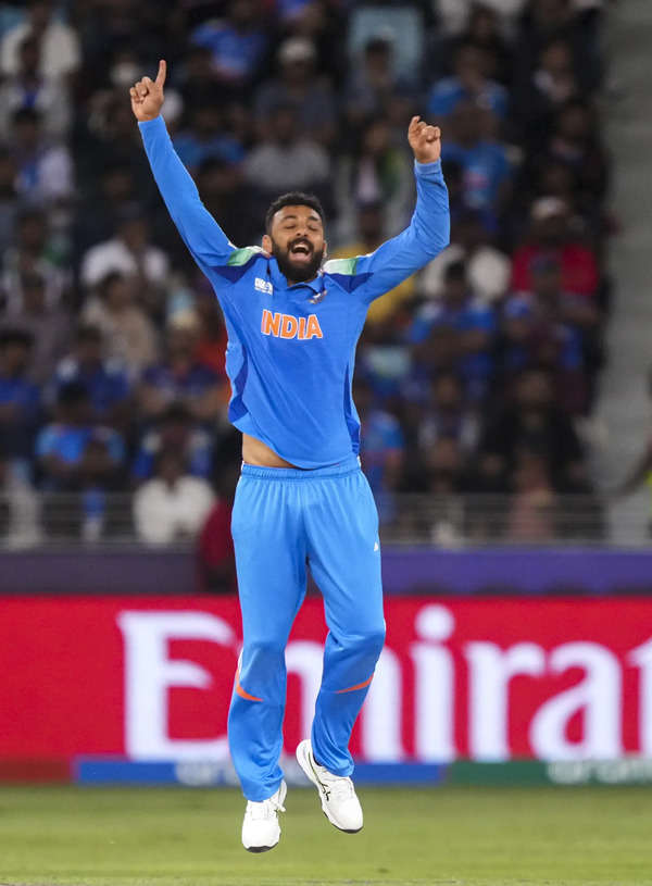 Dubai: India's Varun Chakaravarthy celebrates the wicket of New Zealand's Glenn ...