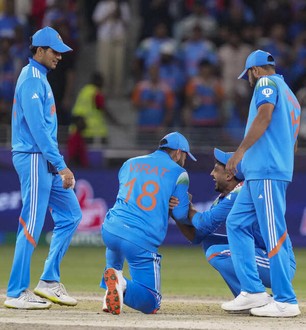Dubai: India's Virat Kohli, who tried to touch the feet of teammate Axar Patel, ...