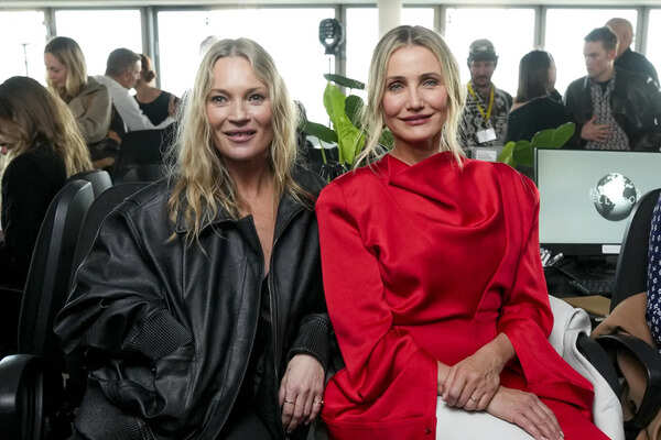 Kate Moss, left, and Cameron Diaz attend the Stella McCartney Fall/Winter 2025-2026 Womenswear collection presented in Paris, Wednesday, March 5, 2025. (Photo by Scott A Garfitt/Invision/AP) Stella McCartney puts provocative twist on the 'open office' at Paris Fashion Week