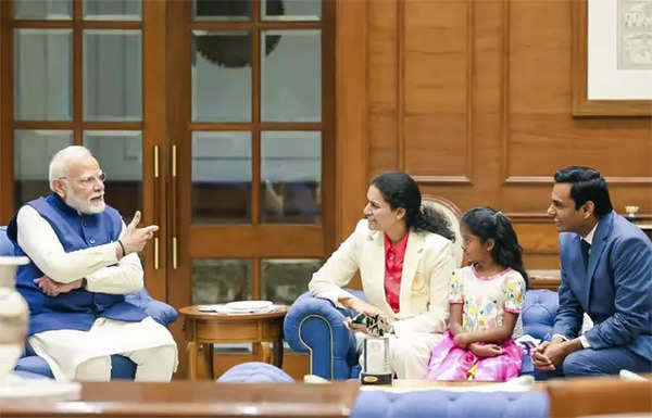 PM Modi meets Koneru Humpy with her husband and daughter