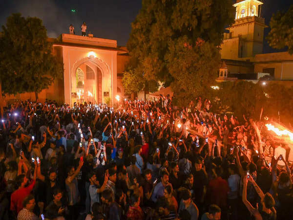 Public gathered outside the City Palace for a glimpse of the festivities
